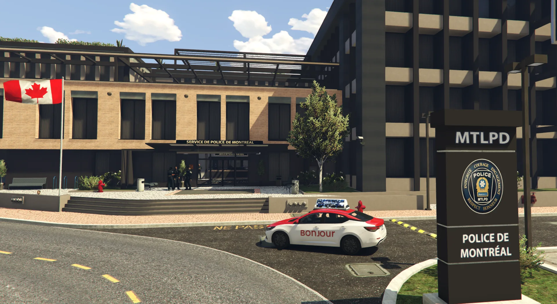 L'entrée du poste de la Police de Montréal, avec le drapeau du Canada et l'enseigne POLICE DE MONTRÉAL